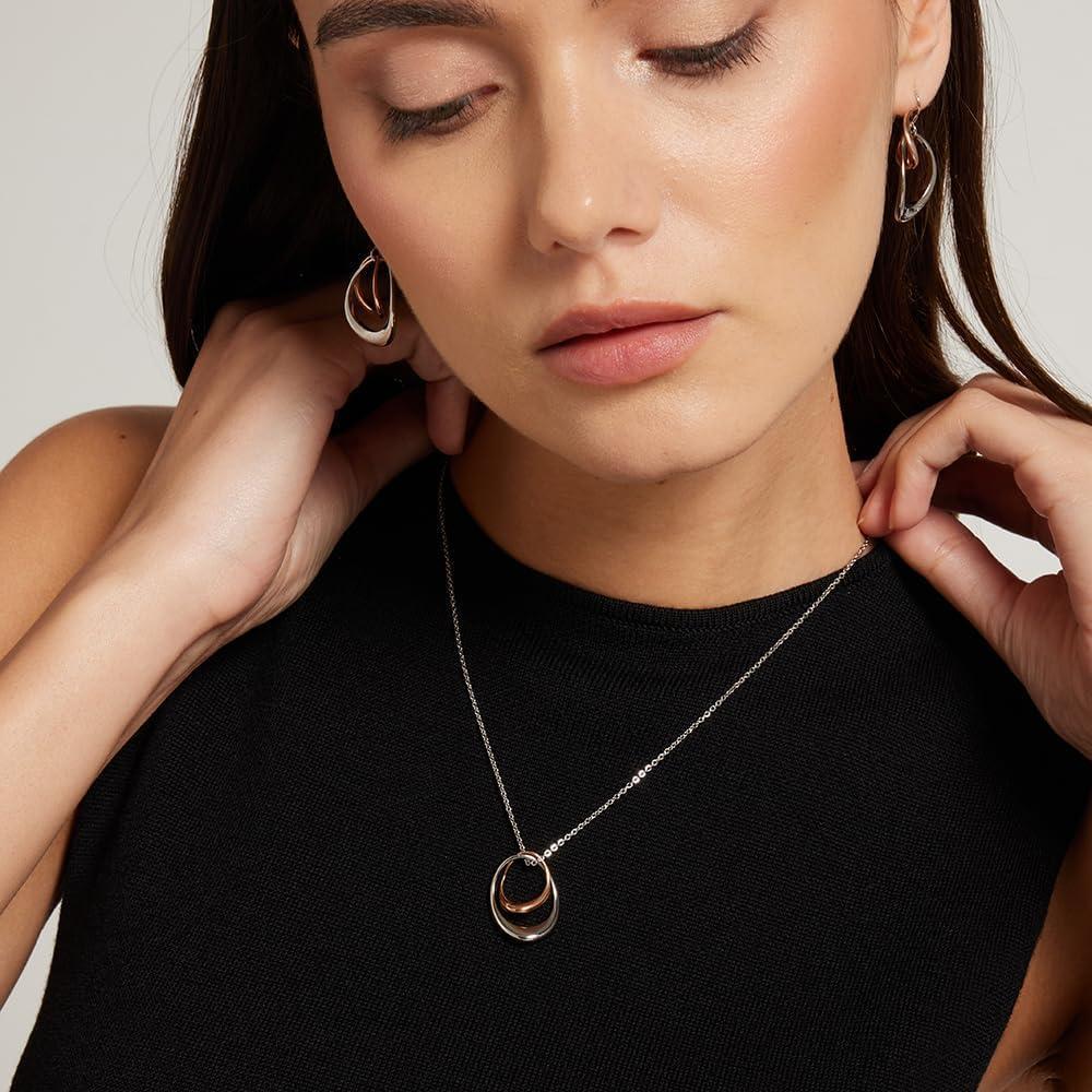 Collar con colgante Calvin Klein para mujeres: Estilo elegante con contornos escultóricos y acabado pulido